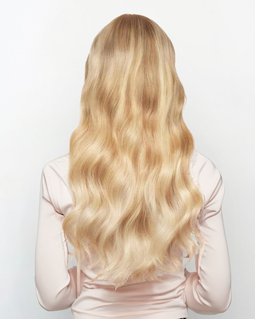 Woman with long wavy blonde hair viewed from the back wearing Extra Piece - Sunkissed 