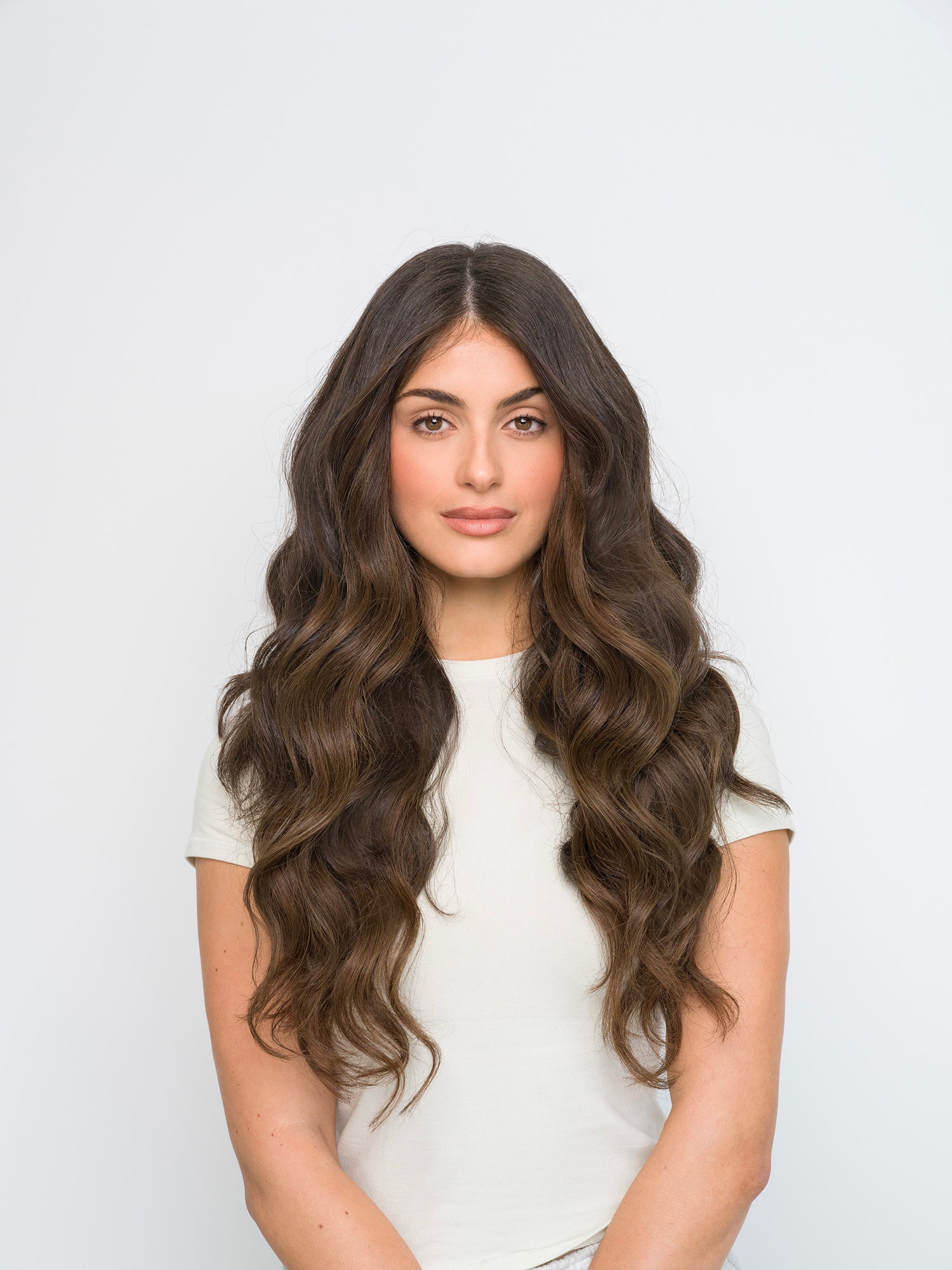 Woman with long wavy dark brown hair showcasing Extra Hair Extension Piece - 