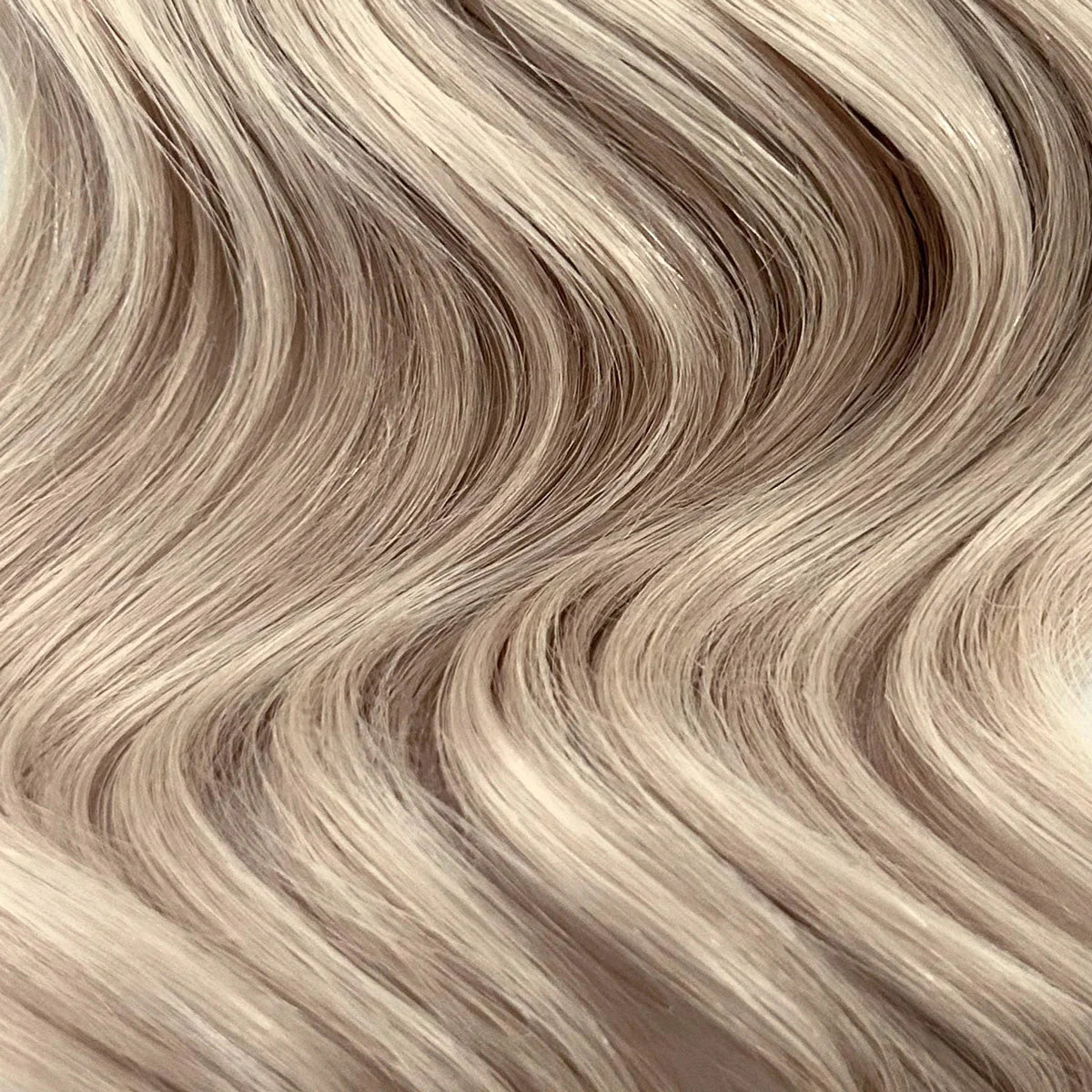 Extra Piece Medium Ash Blonde 24A smooth, natural-looking hair texture with soft, flowing waves close-up