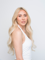 Woman with long wavy blonde hair wearing Extra Hair Extension Piece - Bohemian Blonde 