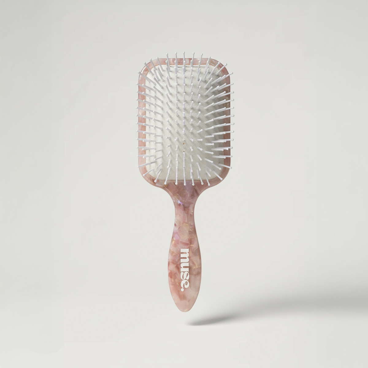 Muse Luxe Wet & Dry Paddle Brush with ergonomic handle and flexible bristles for smooth detangling on wet or dry hair