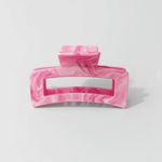 Pink marbled hair accessory designed for secure hold and style called Muse Claw Clip